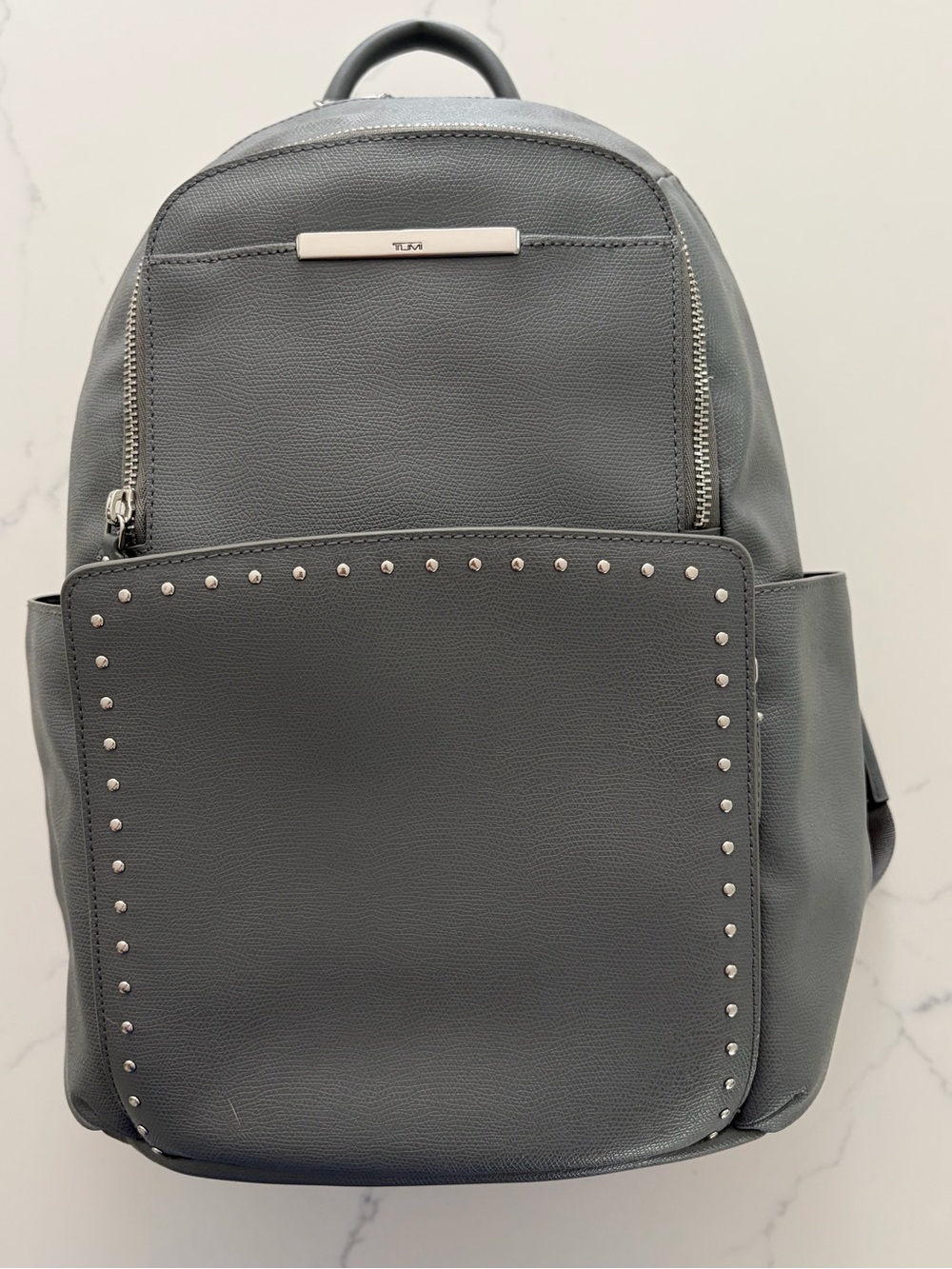 Tumi Women’s Gray Leather Studded Backpack. Large size.
NWOT. Never used it. - Picture 3 of 16